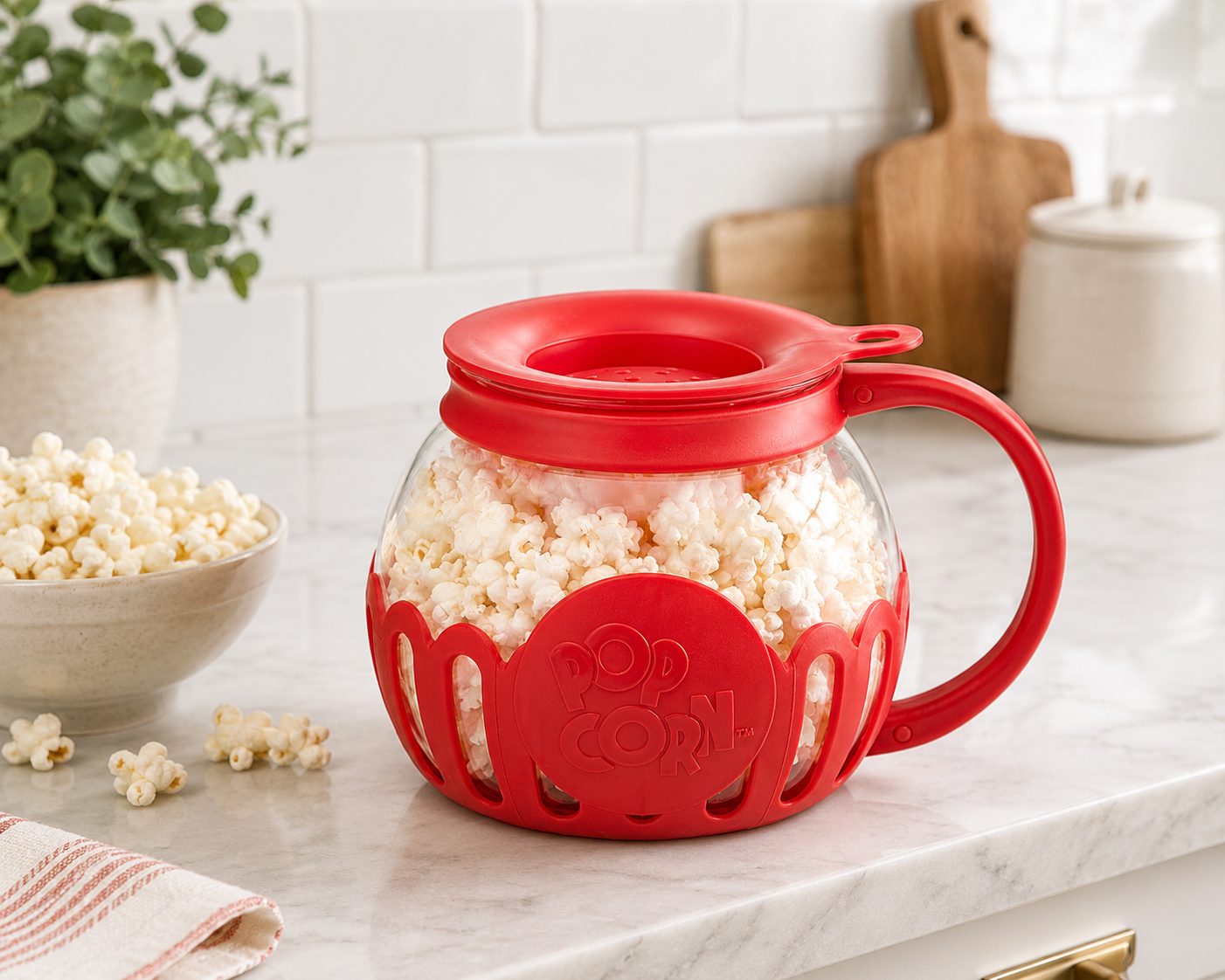 Micro-Pop microwave popcorn popper full of popped corn beside a serving bowl