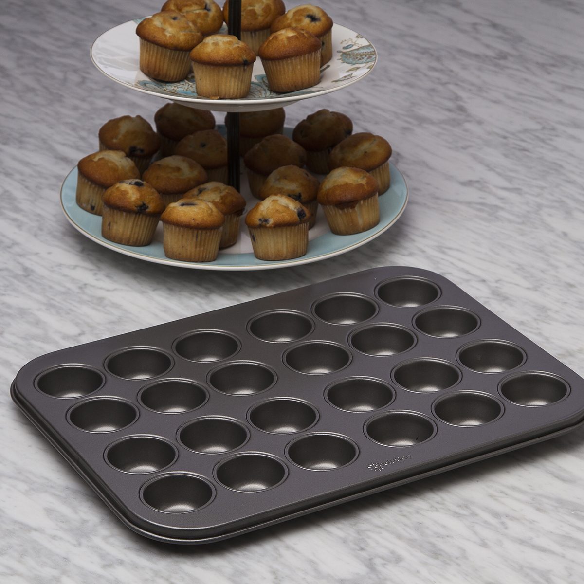 Ecolution BakeIns 24-cup mini muffin pan with fresh baked muffins