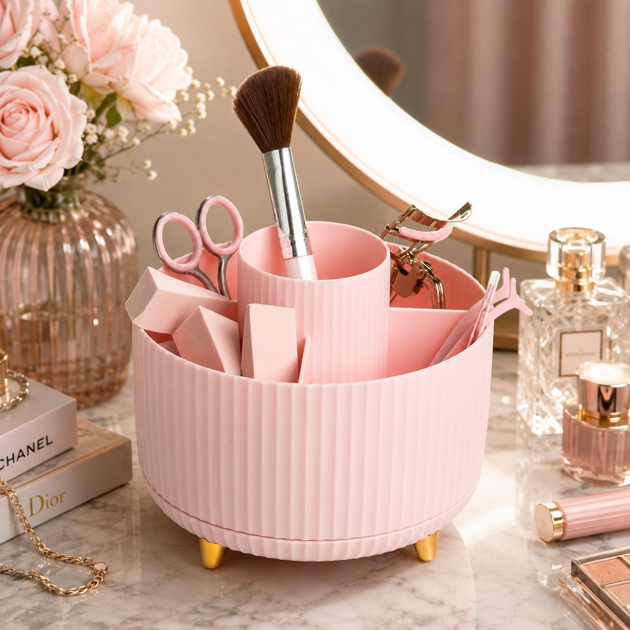 Paris Hilton rotating makeup organizer in blush pink on a marble vanity