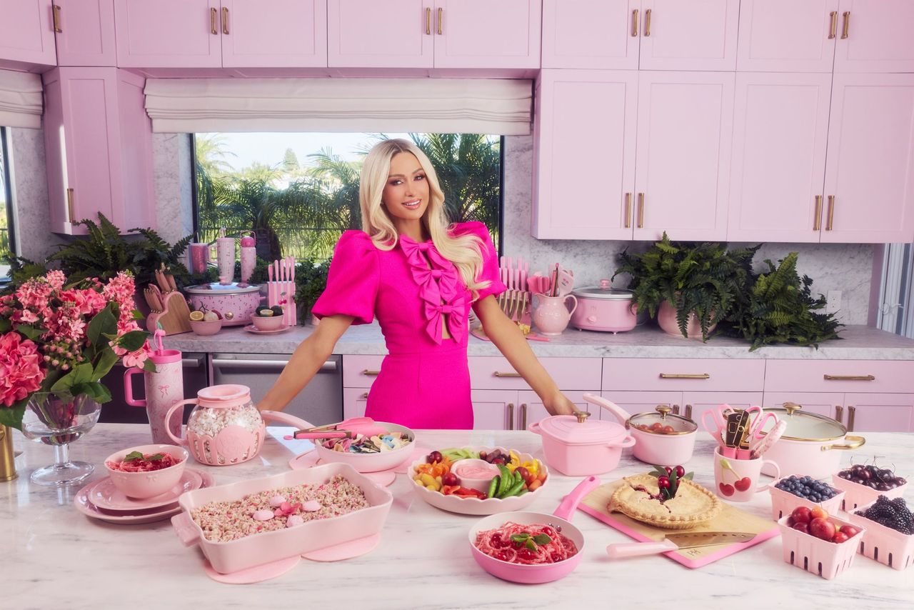 Paris Hilton at her kitchen counter with the Epoca-built collection: food storage, bakeware, dinnerware and drinkware
