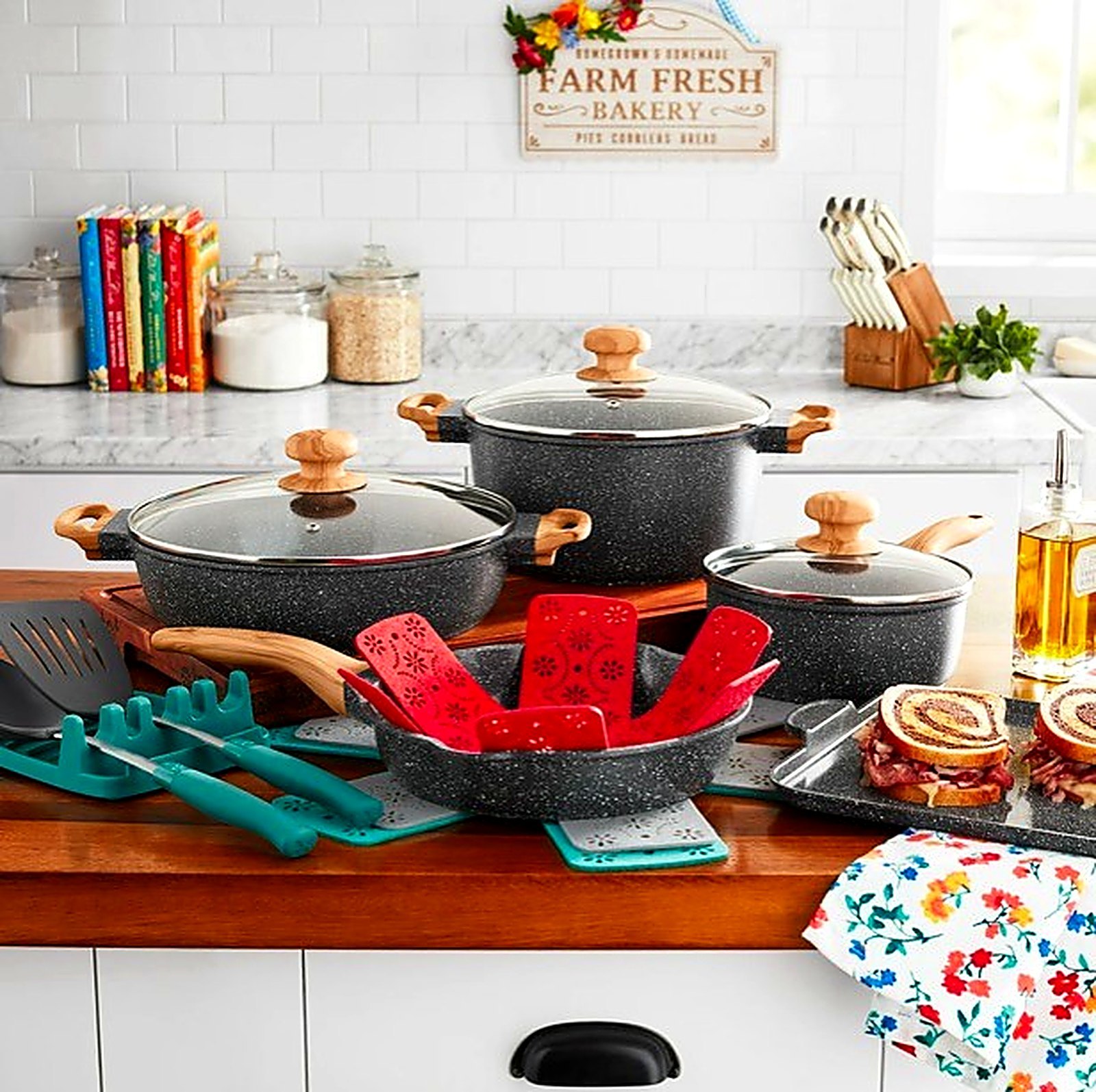 Pioneer Woman charcoal speckle cast aluminum cookware set on a farmhouse counter