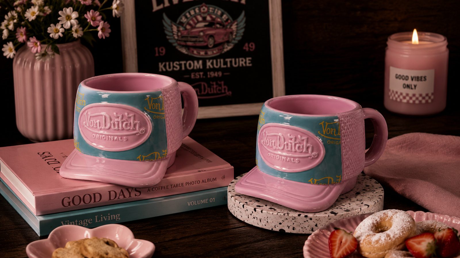 Von Dutch pink and teal mugs on a bright counter